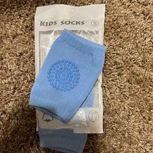 Crawling socks. New. Yellow, black, khaki, blue. Listing one pair. You pick colo